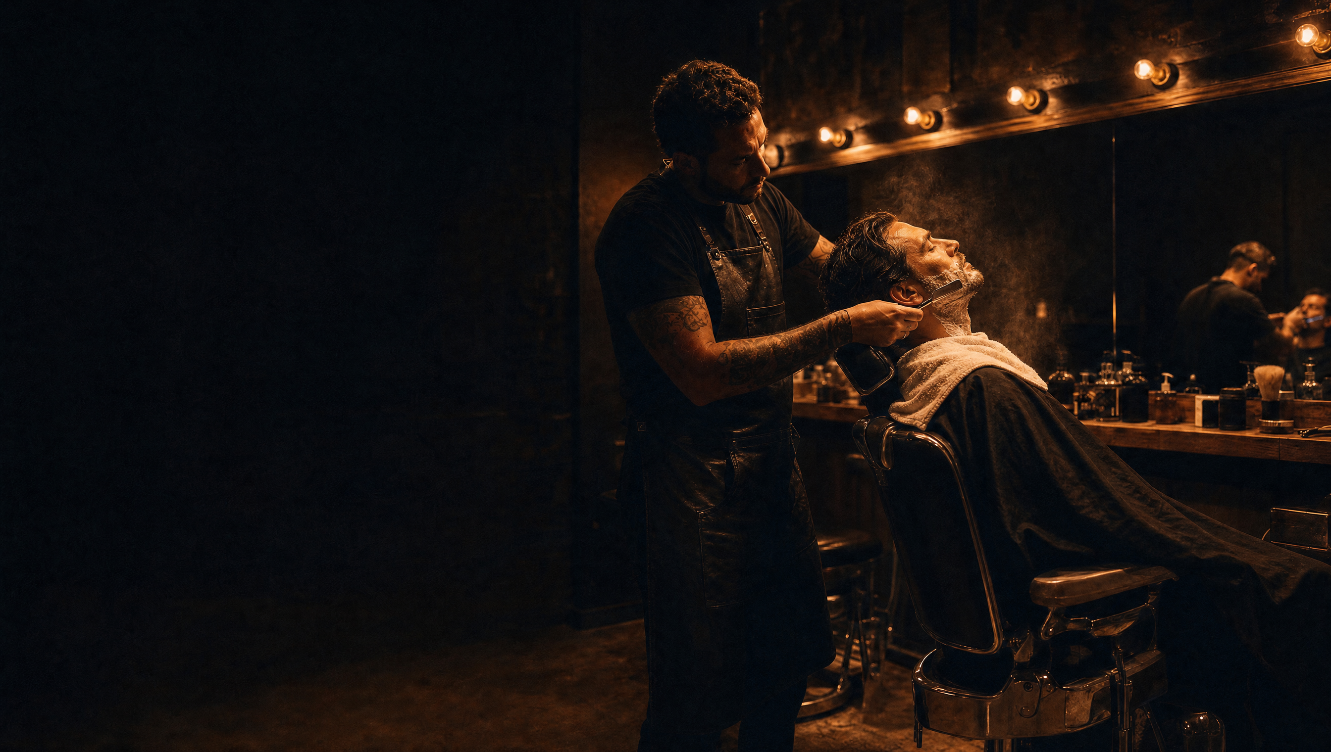 A barber giving a hot lather straight razor shave in the chair at Brooklin Barber.
